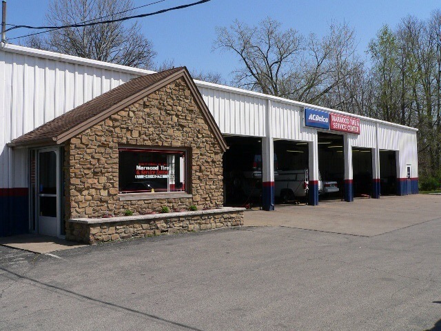 Marwood Tire & Service Center building with open service bay doors